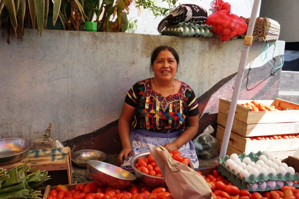 Lady selling tomatoes vegtable market San Pedro Guatemala