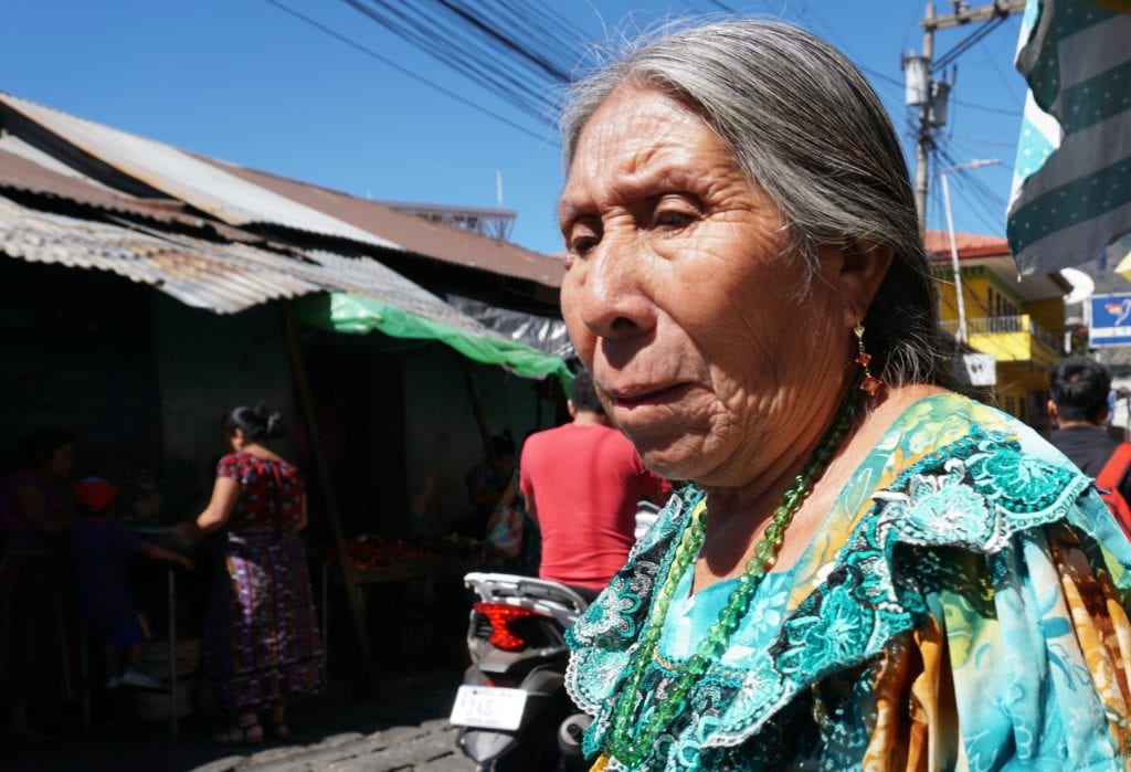 Older lady in Mayan dress at local market San Pedro