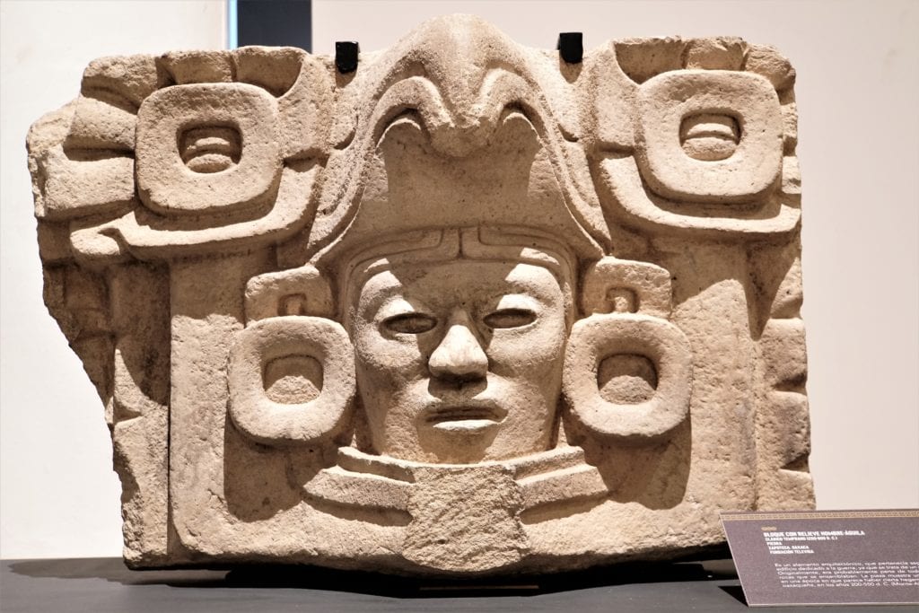 Mayan mask stone piece at Palacio Cantón