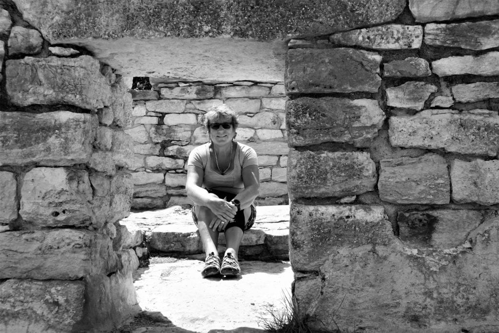 woman in window of Xcambo Mayan ruin