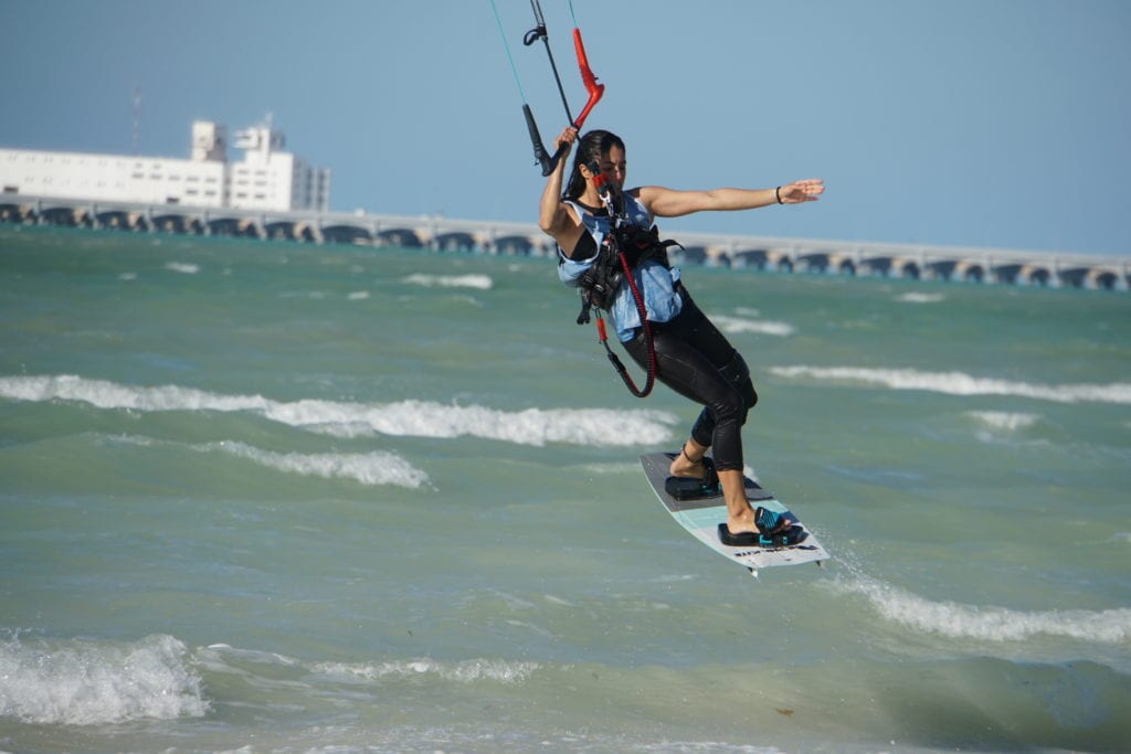 Girl kite surfing in air board horizontal