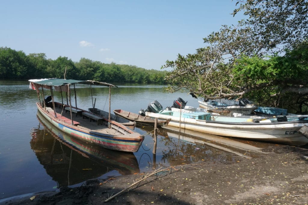 fishing boats docked on river