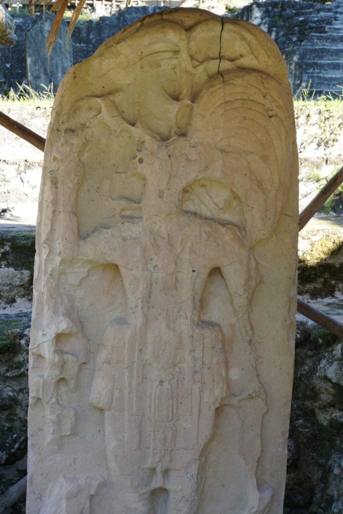 Stelae chief with head dress Tikal