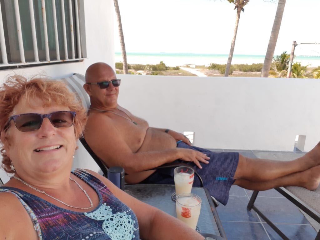 Cindy & I sitting having drink on Airbnb deck Progreso