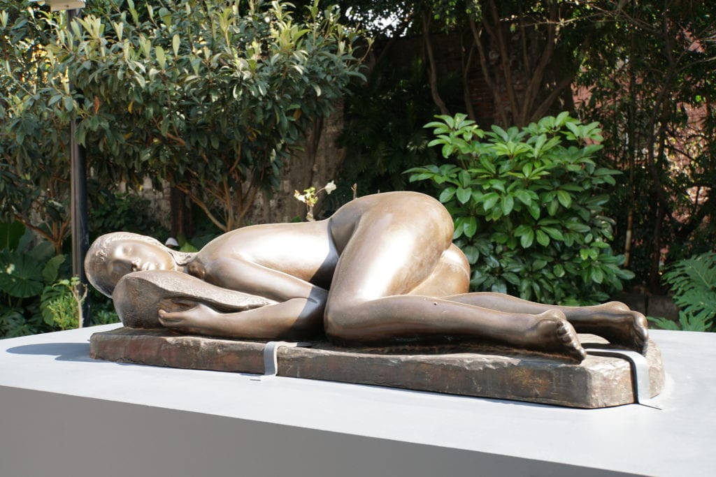 Bronze art women's laying naked on side