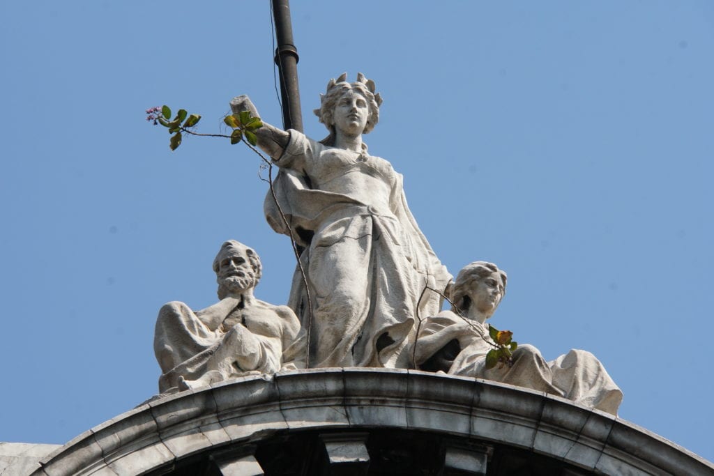 Stone sculpture top of building 29 Av Francisco I. Madero