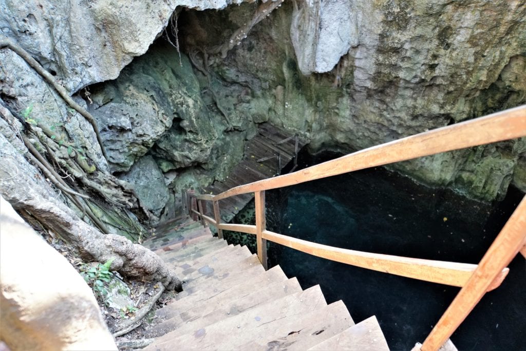 Looking down steep staircase into Yah Nah cenote