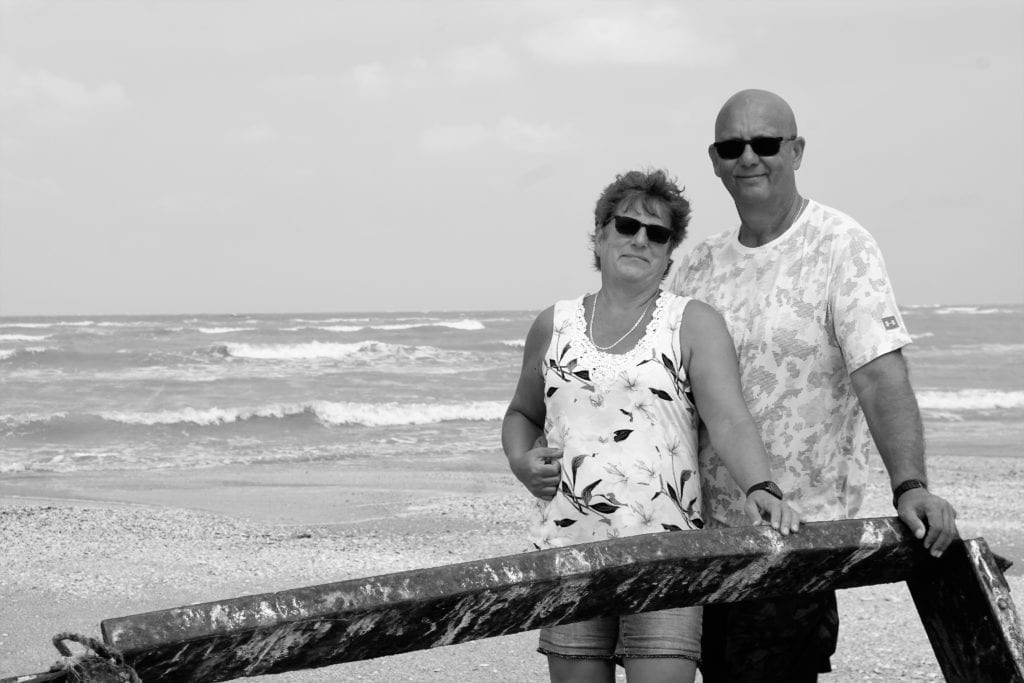 Cindy & I selfie on beach looking out in to waves