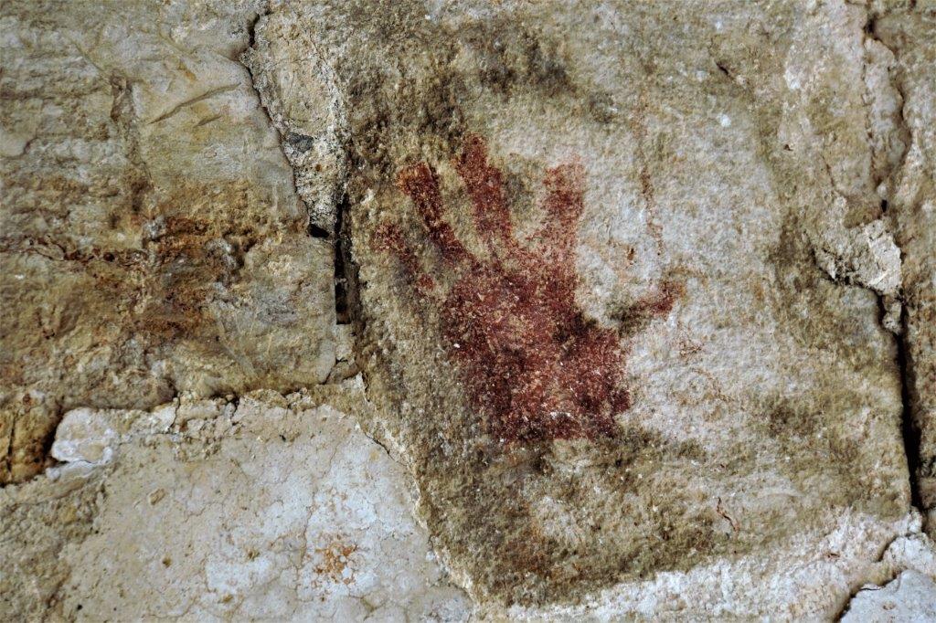 A painted hand on the arc entering into the nunnery