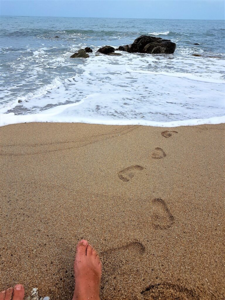 Ao Nang Yee Beach foot prints leading from the water