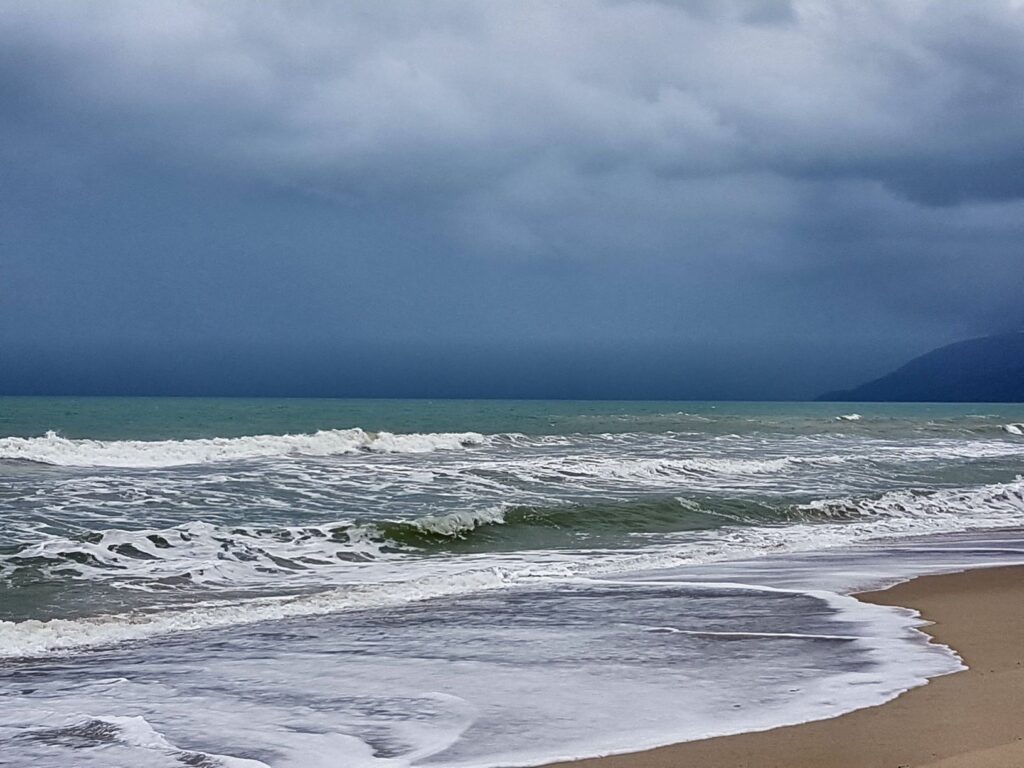 Hua Thanon Beach  with storm clouds in the horizon