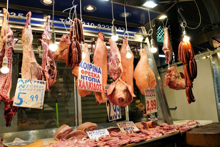 pork meat hanging in the Athens market place