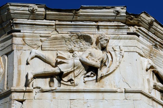 sculpture on one side of wind tower roman Agora