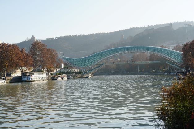 Peace Bridge crossing river in Tbilisi