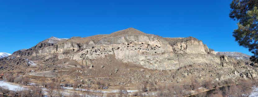 Pan view of Vardzia Cave Monastery from across the river