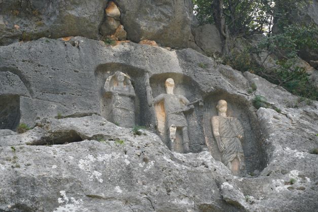 Carved figures at rock tombs near Kanlıdivane