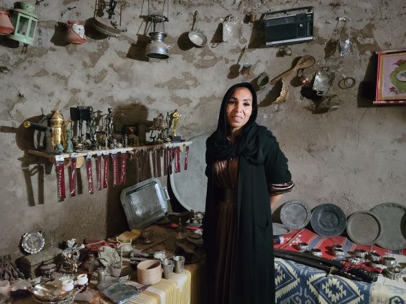 Woman inside beehive house