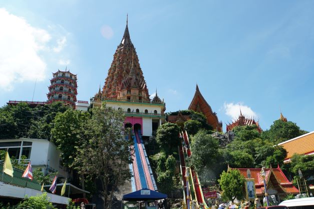 Looking stairs up to Tiger Cave Temple from parking lot