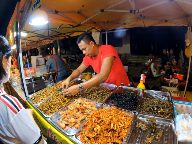 Buying grubs at the skywalk market